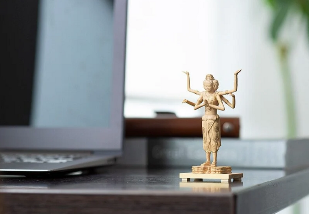 Six-armed Asura statue with a youthful face and hands joined in prayer, reflecting the distinctive iconography associated with the famous Kofuku-ji Asura.