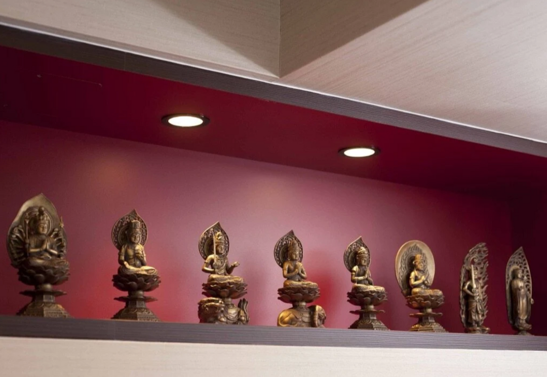 Collection of Japanese Buddhist statues displayed together, showing the contrasting iconography of Nyorai and Bosatsu figures.
