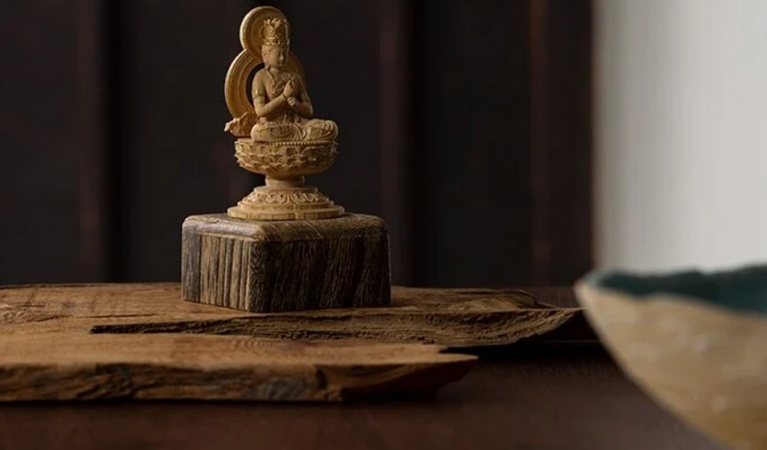 Vairocana Buddha statue seated on a lotus pedestal with hands joined in a symbolic gesture, representing the cosmic Buddha and enlightenment in Mahayana Buddhism.